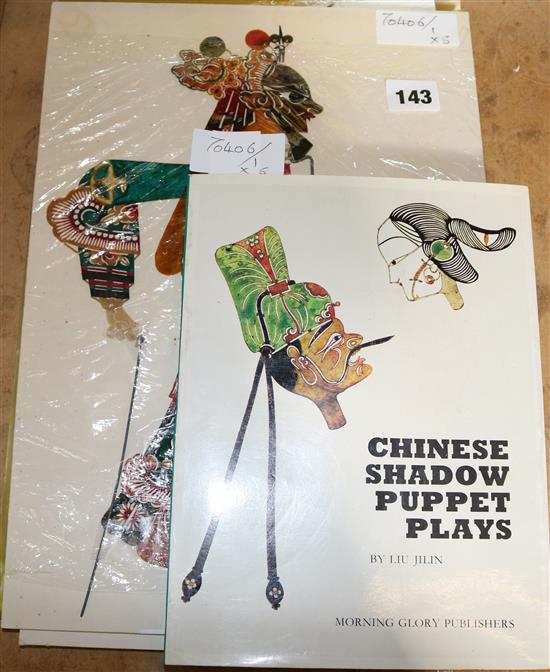 Five Chinese Shadow Puppets together with a book on shadow puppets by Liu Jilin, prox. 30 cm high x 4 cm wide